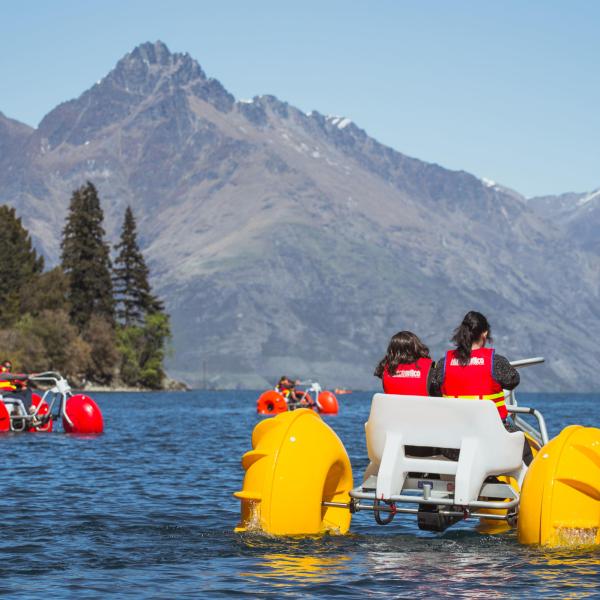 a yellow boat sitting on top of a mountain