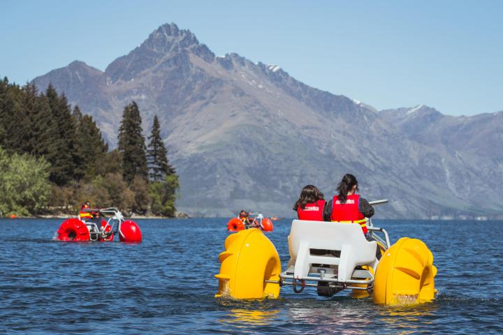 a yellow boat sitting on top of a mountain