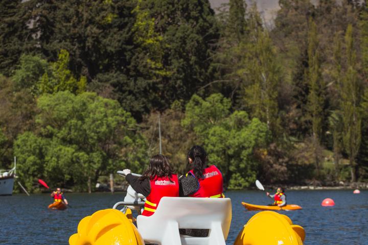 a group of people on a raft in a body of water