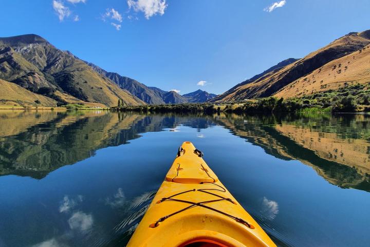 a lake with a mountain in the background