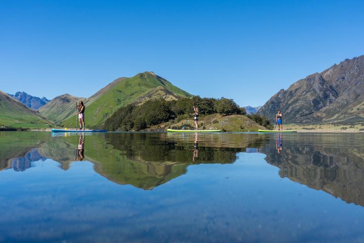 a body of water with a mountain in the background