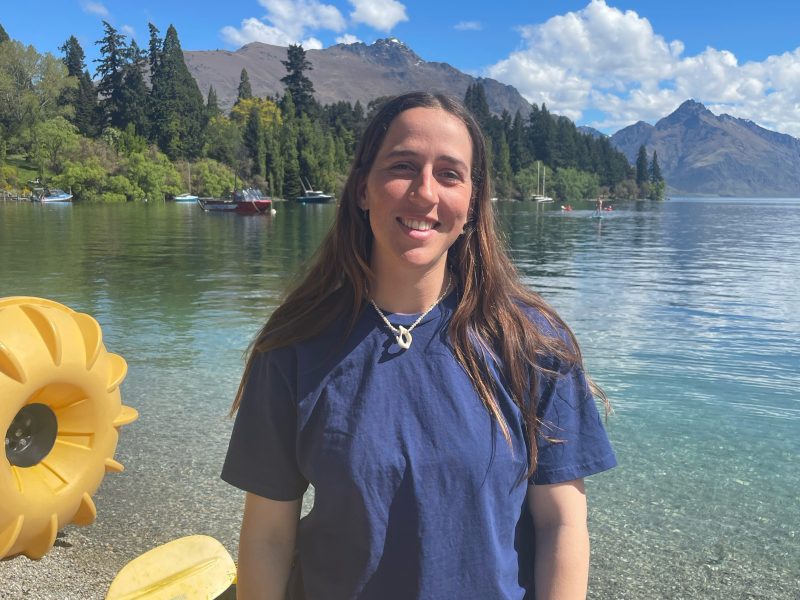a person standing in front of a body of water